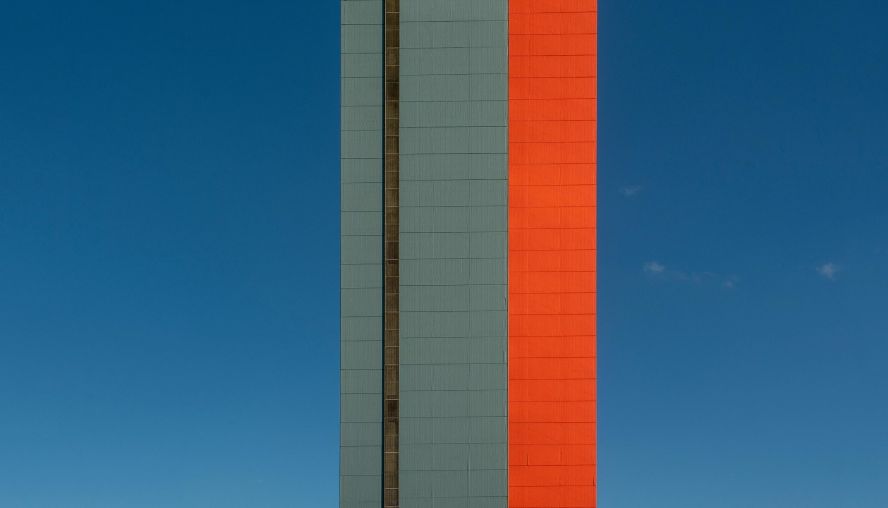 High rise office against a blue sky