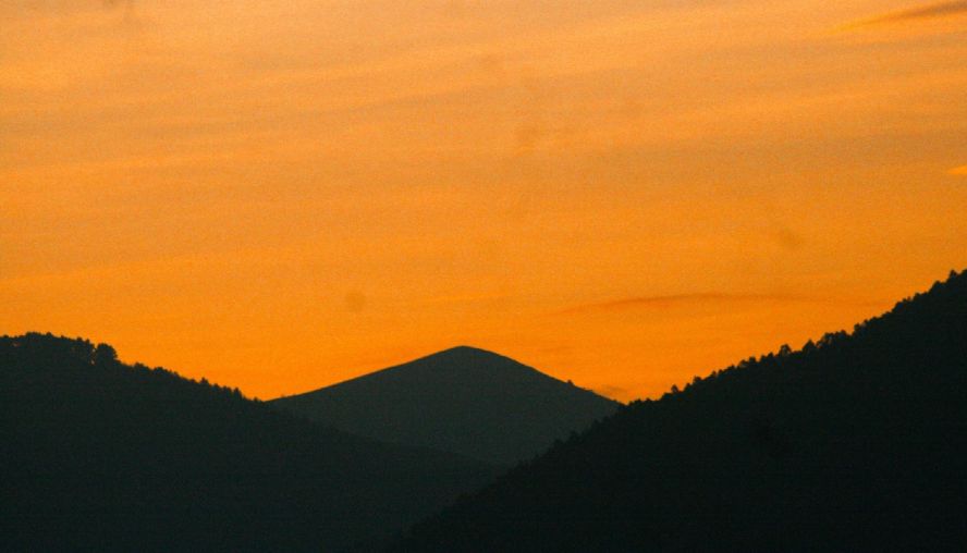 Rolling hills in the distance at sunrise