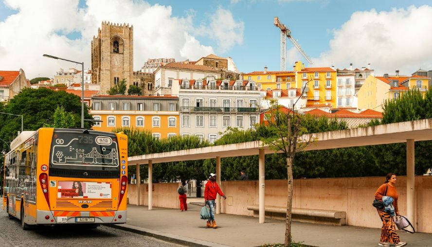 Bus and pedestrians in typical European street scene